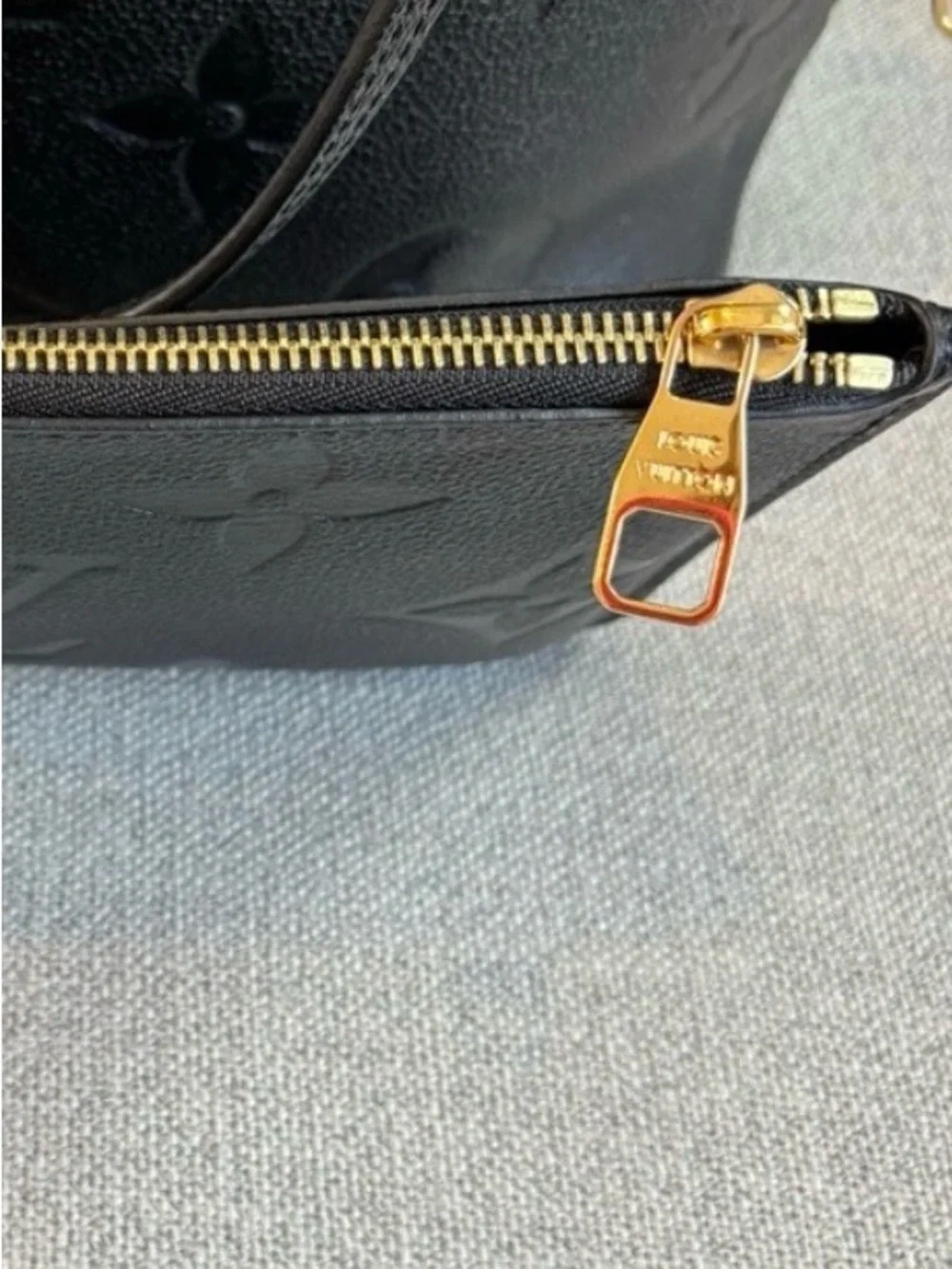 Louis Vuitton Black Embossed Monogram never fall MM with Pouch